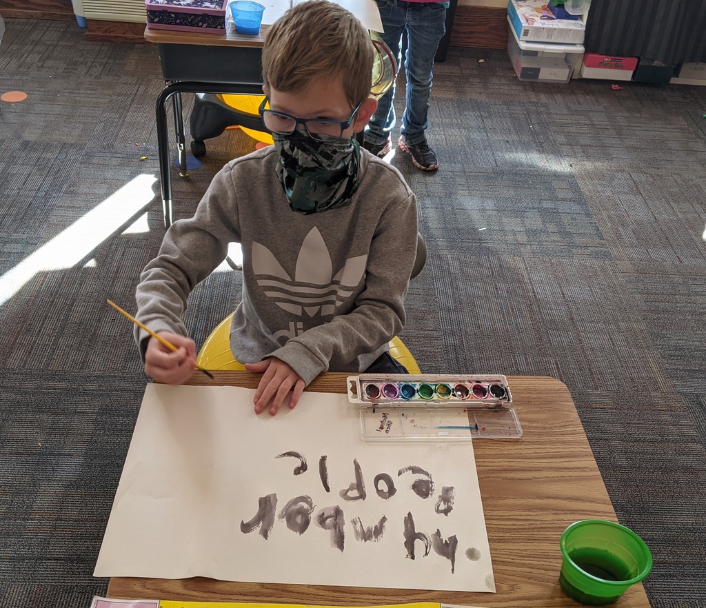 Elijah painting his word wall words.
