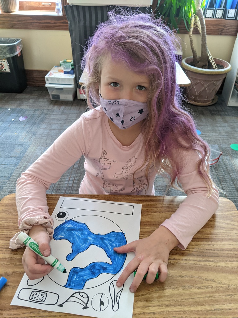 Jessamina coloring her world.