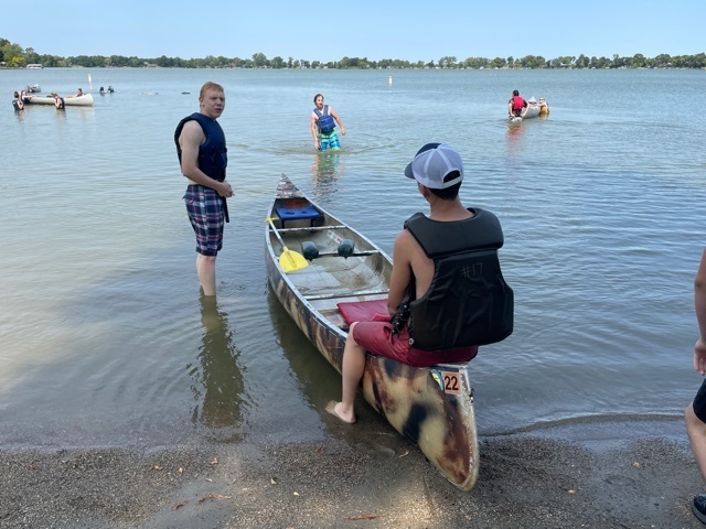 Students canoeing and swimming