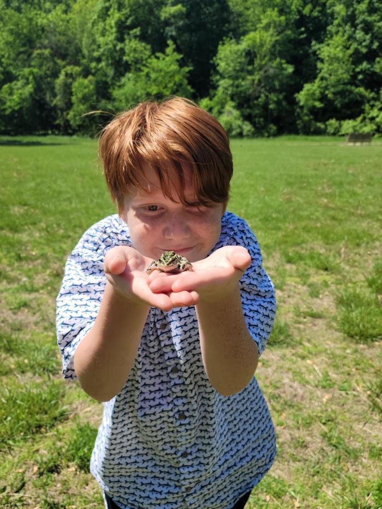 MNCS student enjoying nature today and some frog friends!
