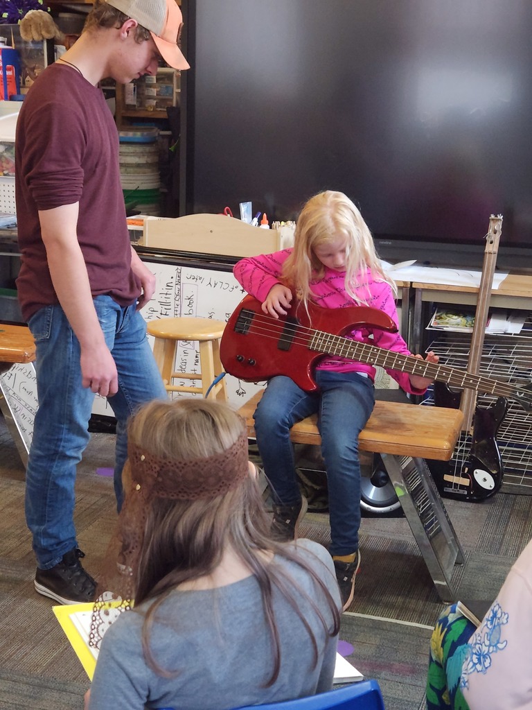 Students in the Tigers class learned recently about the bass guitar and harmonics!