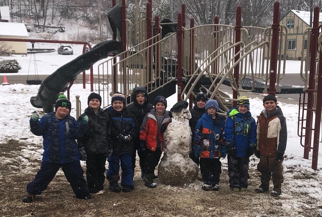 Students had fun building snowmen outside in the winter wonderland!