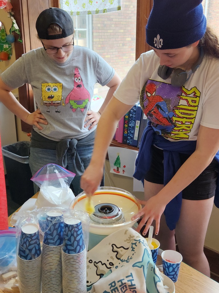 High School students making Truffula treats for the younger students!
